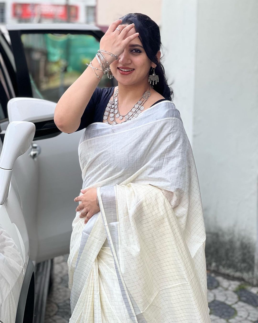 Malayalam Actress Miya George Stills in White Saree Black Blouse